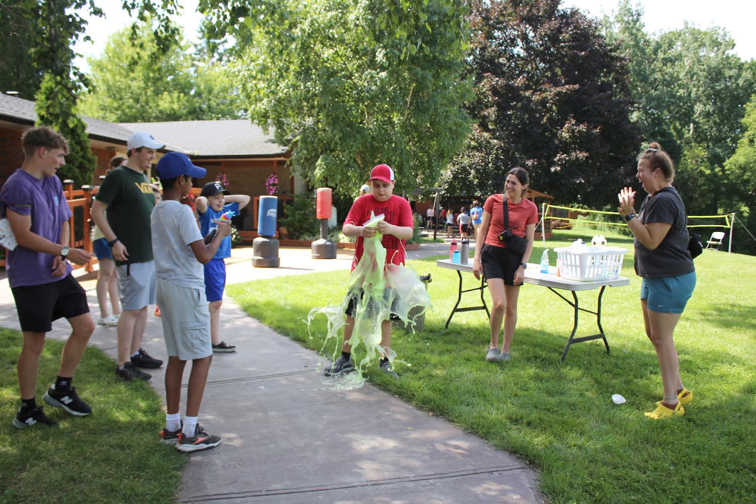 Participants on the front lawn doing explosion experiments.