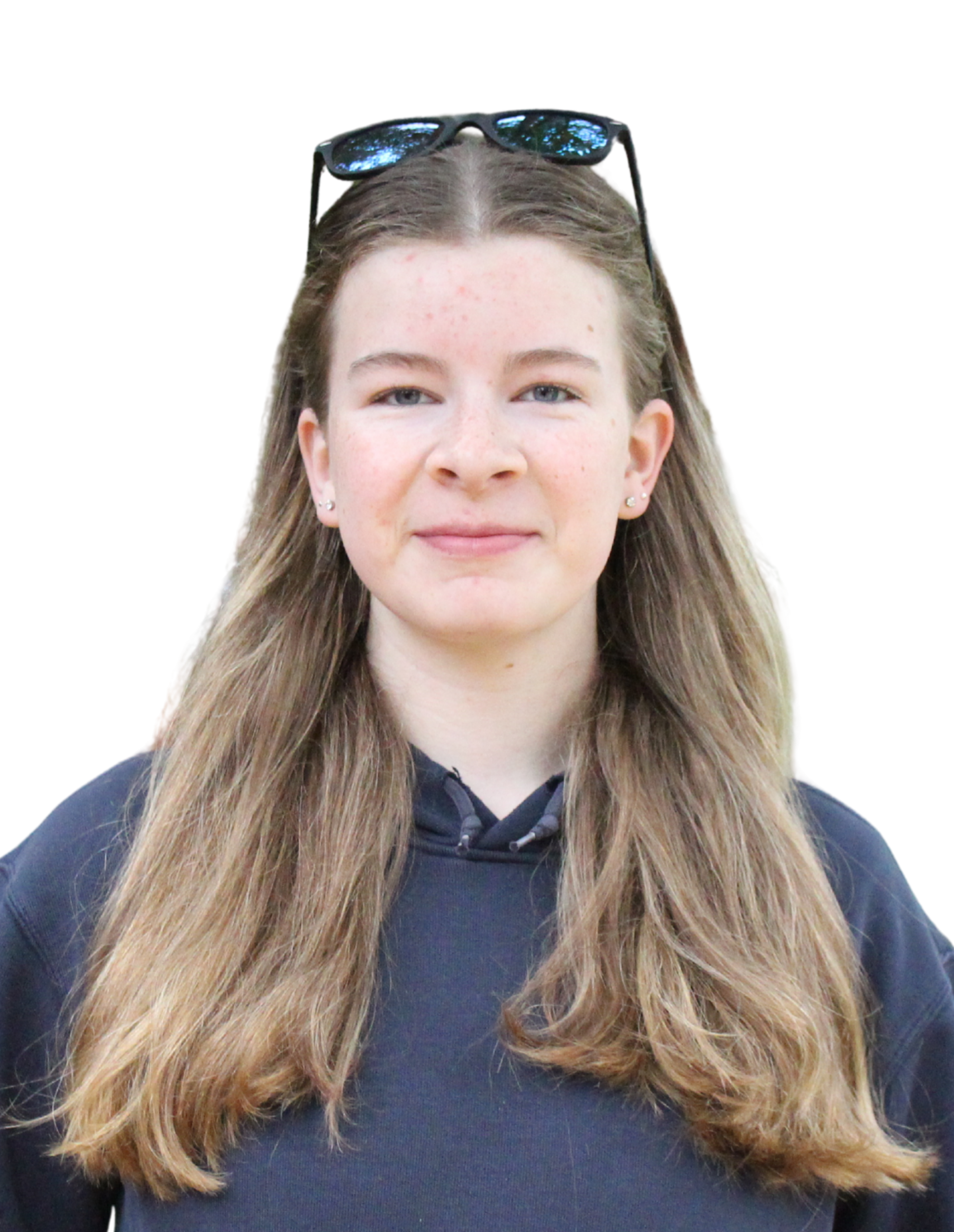 Hailee smiling at camera with sunglasses on head while wearing a dark grey sweater.