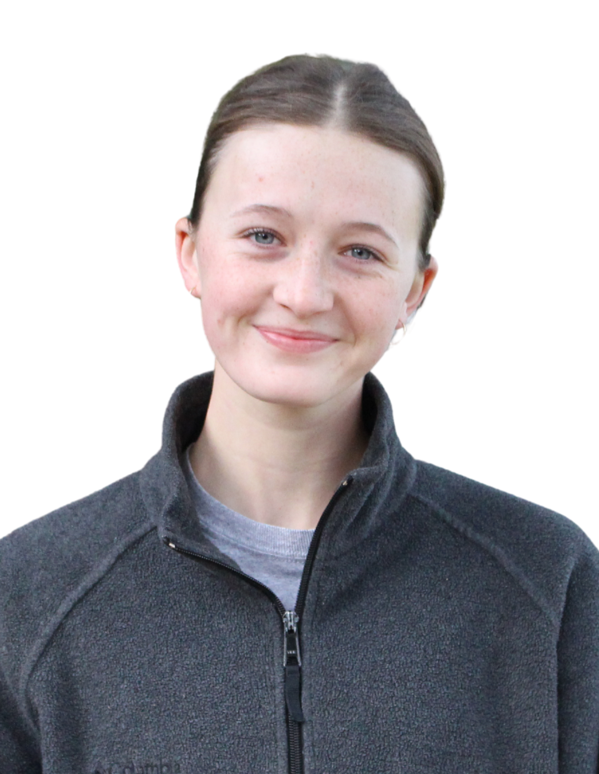 Maddie smiling, wearing a grey quarter-zip sweater.
