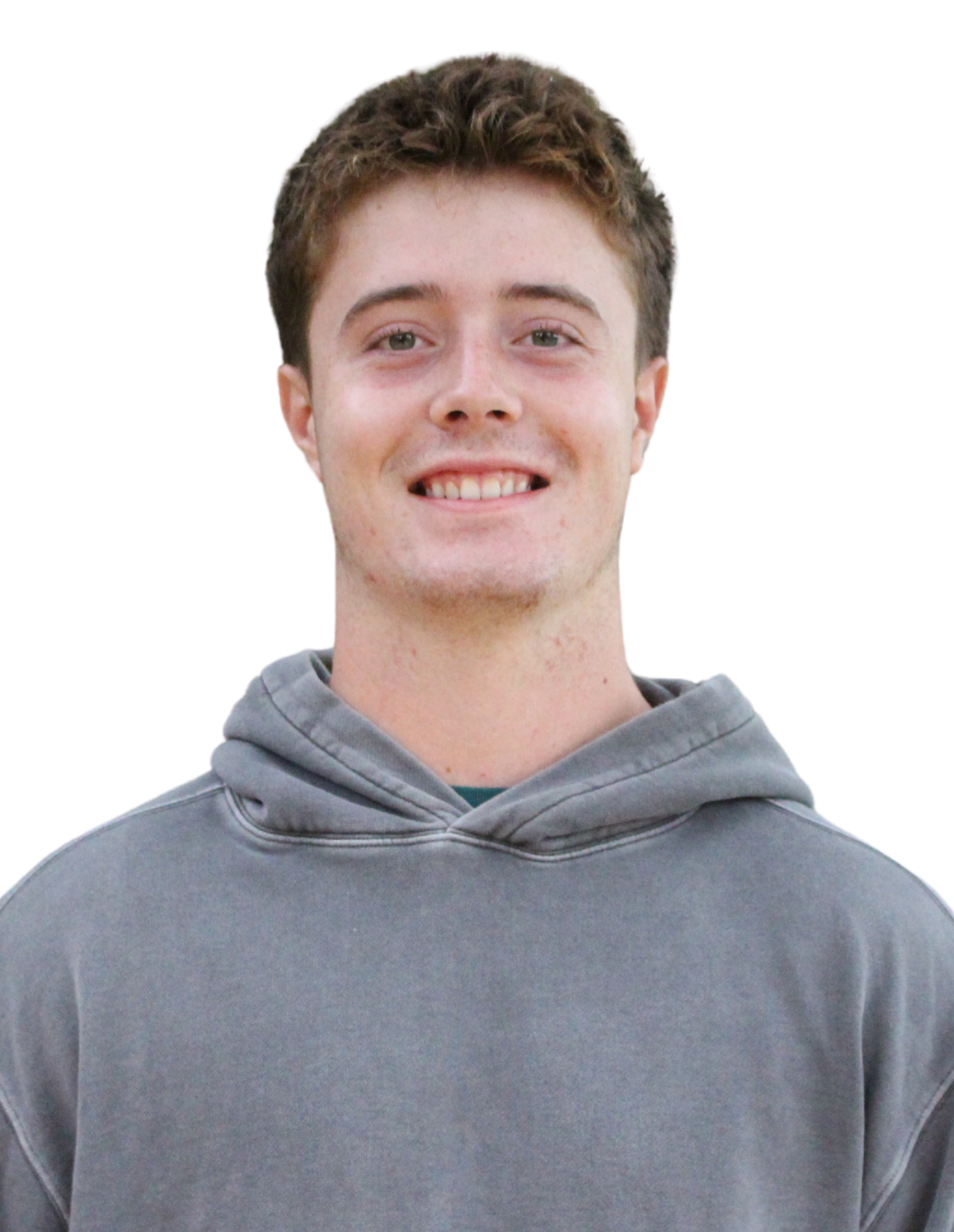 Ryan smiling while wearing a grey sweater.