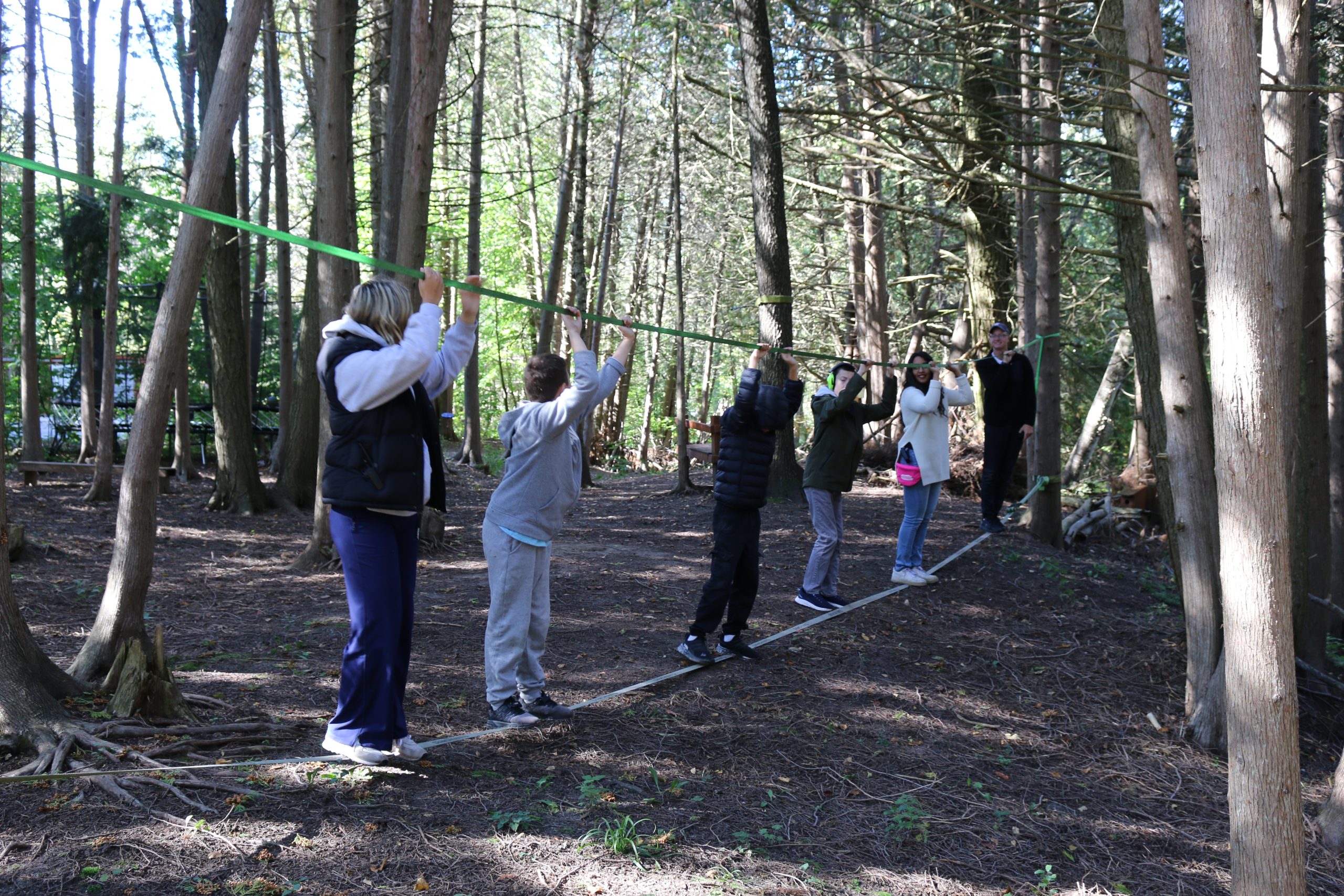 Group of participants and mentors on the slacklines.
